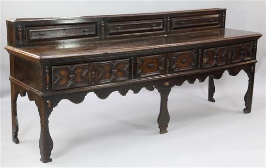 A mid 18th century oak dresser base, W.6ft 11in. D.1ft 10in. H.3ft